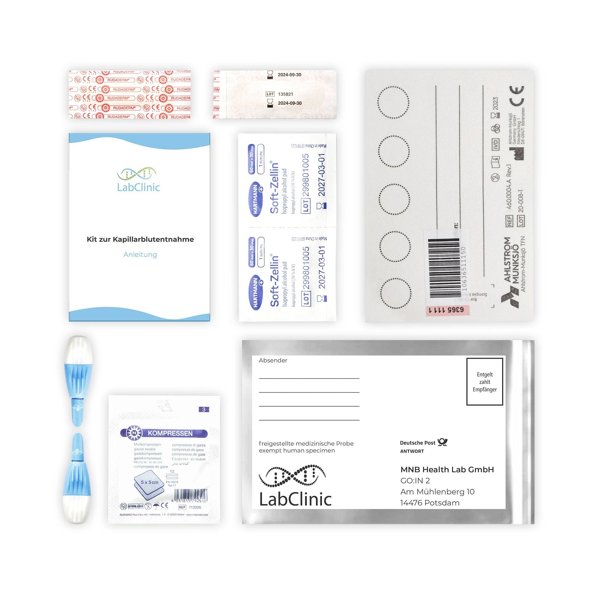 a variety of medical supplies are laid out on a white surface